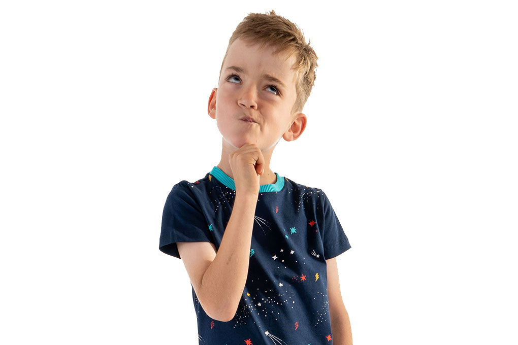 Kid in a thinking pose wearing a Mightly t-shirt