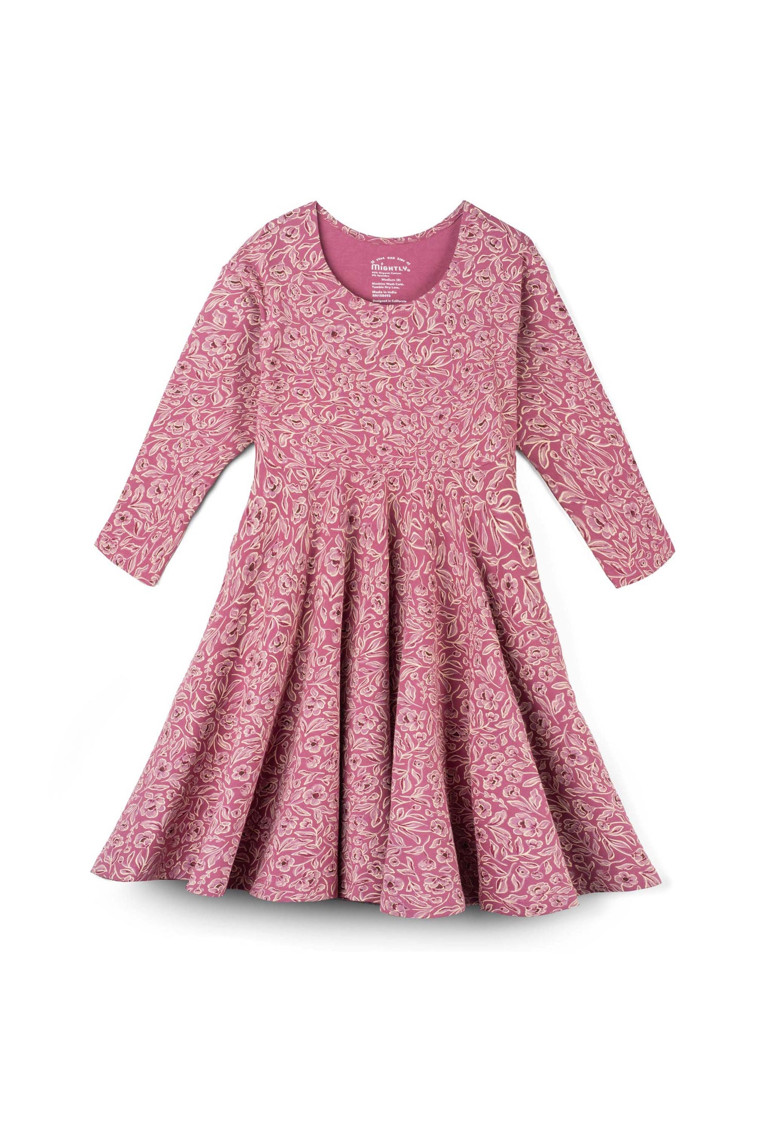 A pink long-sleeve dress with a dense floral and paisley pattern, featuring a round neckline and a flared skirt, shown against a plain white background.