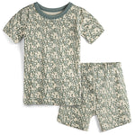 Children's pajama set with short-sleeve top and shorts featuring a green pattern on a beige background.