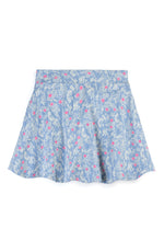 A light blue skort with a delicate white floral and leaf print, accented with small pink flowers, shown flat against a white background.