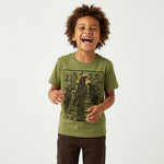 Young child wearing a Mightly 100% organic cotton graphic tee with a black crow print and brown pants.