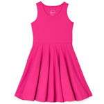 A sleeveless pink twirl dress with side seam pockets made of organic cotton.