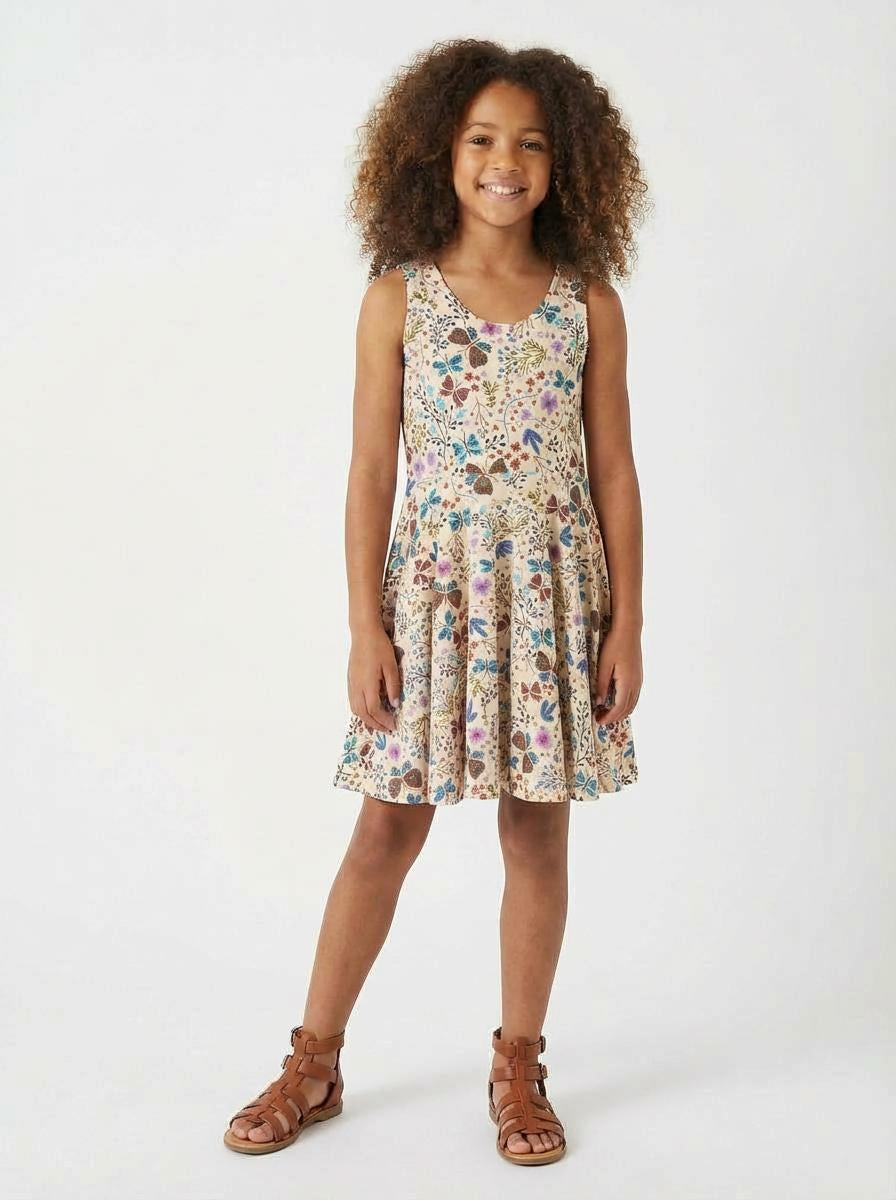 Young girl wearing a floral dress on a white background