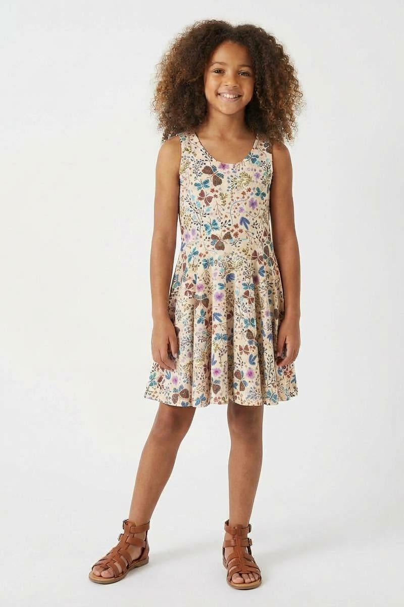 Young girl wearing a floral dress on a white background