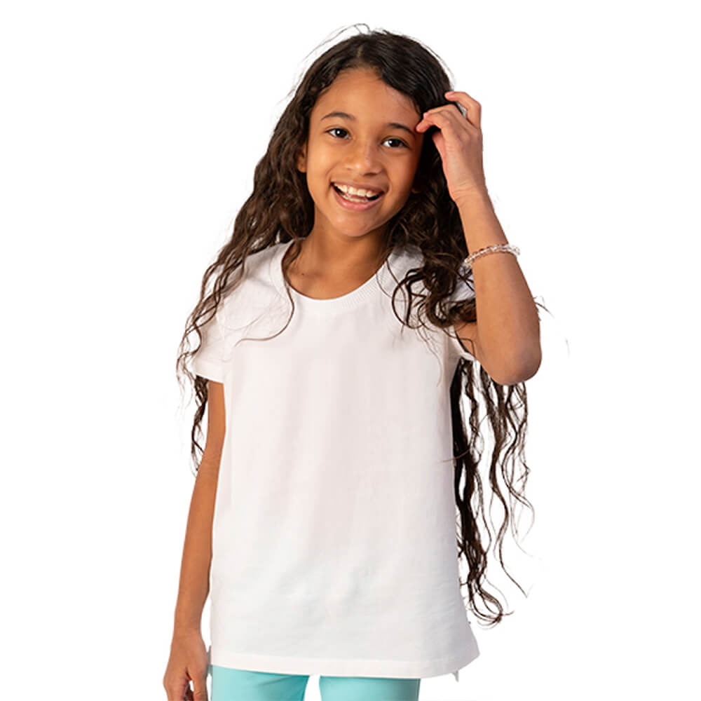 Young girl wearing a white t-shirt and light blue pants on a white background